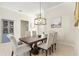 Bright dining room with a stylish chandelier and ample seating, perfect for entertaining at 6216 Donnington Ct, Sarasota, FL 34238