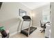 Home gym with a treadmill, desk, large window and natural light at 6216 Donnington Ct, Sarasota, FL 34238