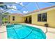 Screened-in pool features a charming fountain and views of the backyard seating area, perfect for relaxation and entertaining at 6216 Donnington Ct, Sarasota, FL 34238