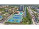 Aerial view of beachfront condos, swimming pool, tennis courts and intercoastal waterway at 6415 Midnight Pass Rd # 502, Sarasota, FL 34242