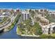 Aerial view of a beautiful coastal community featuring lush landscaping and waterway access at 6415 Midnight Pass Rd # 502, Sarasota, FL 34242