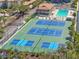 Overhead shot of the community tennis and pickle ball courts along with the pool and community center at 6415 Midnight Pass Rd # 502, Sarasota, FL 34242