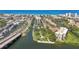 Aerial view showcases waterfront property with boat docks and access to beaches and coastal scenery at 6415 Midnight Pass Rd # 502, Sarasota, FL 34242
