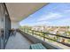 Spacious balcony with seating, offering panoramic views of the surrounding neighborhood and water at 6415 Midnight Pass Rd # 502, Sarasota, FL 34242