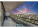 Beautiful balcony at sunset with seating and stunning views of the city and the sky at 6415 Midnight Pass Rd # 502, Sarasota, FL 34242