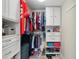 Walk-in closet with custom shelves, hanging rods, and shoe storage at 6415 Midnight Pass Rd # 502, Sarasota, FL 34242