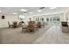 Club room with several tables and chairs plus access to the community pool at 6415 Midnight Pass Rd # 502, Sarasota, FL 34242