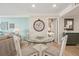 Dining area featuring a glass table, seating for four, and decorative accents at 6415 Midnight Pass Rd # 502, Sarasota, FL 34242