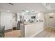 Bright kitchen with granite countertops, stainless steel appliances, and breakfast bar at 6415 Midnight Pass Rd # 502, Sarasota, FL 34242