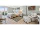 Serene bedroom with balcony access, beach-themed decor, and natural light at 6415 Midnight Pass Rd # 502, Sarasota, FL 34242