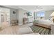 Bright, airy main bedroom with a coastal theme, light wood floors, and walk-out balcony at 6415 Midnight Pass Rd # 502, Sarasota, FL 34242