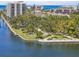 Beautiful waterfront park area featuring lush landscaping, walking paths, and stunning views of the water and beachfront condos at 6415 Midnight Pass Rd # 502, Sarasota, FL 34242