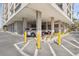 Corner of building showing assigned, covered parking spaces with tropical plants around the building at 6415 Midnight Pass Rd # 502, Sarasota, FL 34242