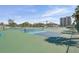Well-maintained tennis courts with buildings in background are great for sports enthusiasts at 6415 Midnight Pass Rd # 502, Sarasota, FL 34242