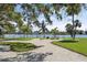 Picturesque waterfront park with picnic tables, benches, and lush greenery provides a serene escape at 6415 Midnight Pass Rd # 502, Sarasota, FL 34242