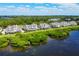 Waterfront condos with lush surroundings provide picturesque views and a serene coastal atmosphere at 65 Tidy Island Blvd, Bradenton, FL 34210