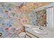 Bathroom with floral wallpaper, vanity with sink, and toilet at 65 Tidy Island Blvd, Bradenton, FL 34210