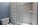 Modern bathroom with a tiled shower and glass block partition for natural light at 65 Tidy Island Blvd, Bradenton, FL 34210