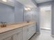 This bathroom features a double vanity, ample counter space, and a glass block shower at 65 Tidy Island Blvd, Bradenton, FL 34210