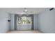 Serene bedroom featuring a large window with elegant curtains and soft natural light at 65 Tidy Island Blvd, Bradenton, FL 34210