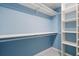 Organized walk-in closet with shelving and ample storage space, perfect for any wardrobe at 65 Tidy Island Blvd, Bradenton, FL 34210