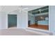 Open-concept living space with tile floors in the foreground and hardwood floors beyond at 65 Tidy Island Blvd, Bradenton, FL 34210