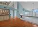 Open-concept living room with vaulted ceilings, fireplace, and hardwood floors offers a bright, inviting space at 65 Tidy Island Blvd, Bradenton, FL 34210