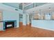 Open-concept living space with a fireplace and a kitchen beyond at 65 Tidy Island Blvd, Bradenton, FL 34210
