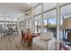 Bright sitting area featuring ample natural light, comfortable chairs, and views of the pool at 65 Tidy Island Blvd, Bradenton, FL 34210