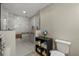 This bathroom features a gorgeous zero entry shower with a rain shower head and grab bars at 6916 W Country Club N Dr # 9B, Sarasota, FL 34243