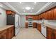 Bright kitchen features stainless steel appliances, custom cabinets, and granite countertops at 6916 W Country Club N Dr # 9B, Sarasota, FL 34243