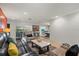 The open-concept room features tile flooring, comfortable seating, and seamless access to the dining area at 6916 W Country Club N Dr # 9B, Sarasota, FL 34243