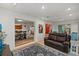 Spacious living room connecting to dining area, complete with comfortable seating and open layout at 6916 W Country Club N Dr # 9B, Sarasota, FL 34243