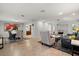 An open floor plan connects the living room and dining area with tile floors, and bright recessed lighting at 6916 W Country Club N Dr # 9B, Sarasota, FL 34243