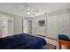 This is a lovely main bedroom with a blue comforter and a dresser with lots of drawers at 6916 W Country Club N Dr # 9B, Sarasota, FL 34243