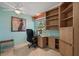 This home office is fully equipped with built-in cabinets and a ceiling fan at 6916 W Country Club N Dr # 9B, Sarasota, FL 34243