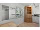 This walk-in closet has lots of shelves and storage and a window to allow for natural light at 6916 W Country Club N Dr # 9B, Sarasota, FL 34243