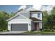 Charming two-story home with a gray color scheme, a two-car garage, and professional landscaping at 7072 Foxboro Way, Nokomis, FL 34275