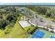 A high angle view showcases the volleyball courts, community playground, walking paths and courts at 7160 Amelia River Dr, Parrish, FL 34219