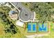 Aerial view of the community amenities with a playground, sand volleyball, tennis and basketball courts at 7160 Amelia River Dr, Parrish, FL 34219