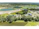 Aerial view of the community with ponds and roadways, showcasing the pool, clubhouse, courts, and playground at 7160 Amelia River Dr, Parrish, FL 34219