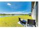 Serene backyard featuring a waterfront view with outdoor seating at 7160 Amelia River Dr, Parrish, FL 34219