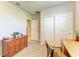 A simple bedroom features a desk area, closet space, and a small table at 7160 Amelia River Dr, Parrish, FL 34219