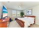 Cozy bedroom with large windows, plush carpet, and a ceiling fan at 7160 Amelia River Dr, Parrish, FL 34219