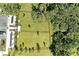Overhead shot of the community dog park, a fenced in area for dogs, including parking at 7160 Amelia River Dr, Parrish, FL 34219