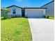 Charming single-Gathering home with a well-maintained lawn and two-car garage at 7160 Amelia River Dr, Parrish, FL 34219