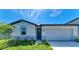 Attractive one-story home with stone accents, a two-car garage and a manicured lawn at 7160 Amelia River Dr, Parrish, FL 34219