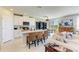 Bright kitchen featuring a center island with seating and modern appliances at 7160 Amelia River Dr, Parrish, FL 34219