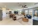 Open living space with a kitchen island, stylish seating, and modern appliances at 7160 Amelia River Dr, Parrish, FL 34219
