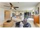 A stylish living space showcases open concept design with a dining area, kitchen, and living room at 7160 Amelia River Dr, Parrish, FL 34219